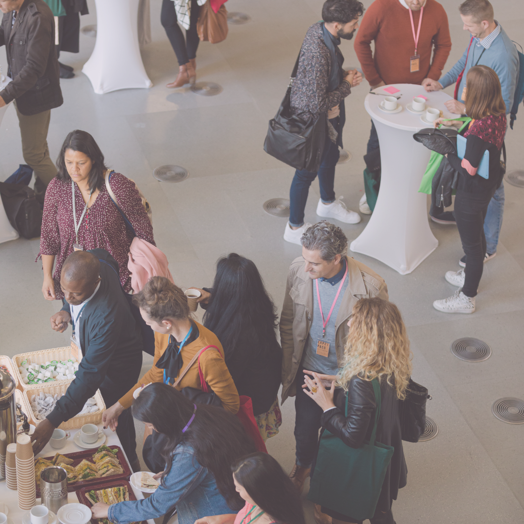 Group of people standing and chatting at a social gathering